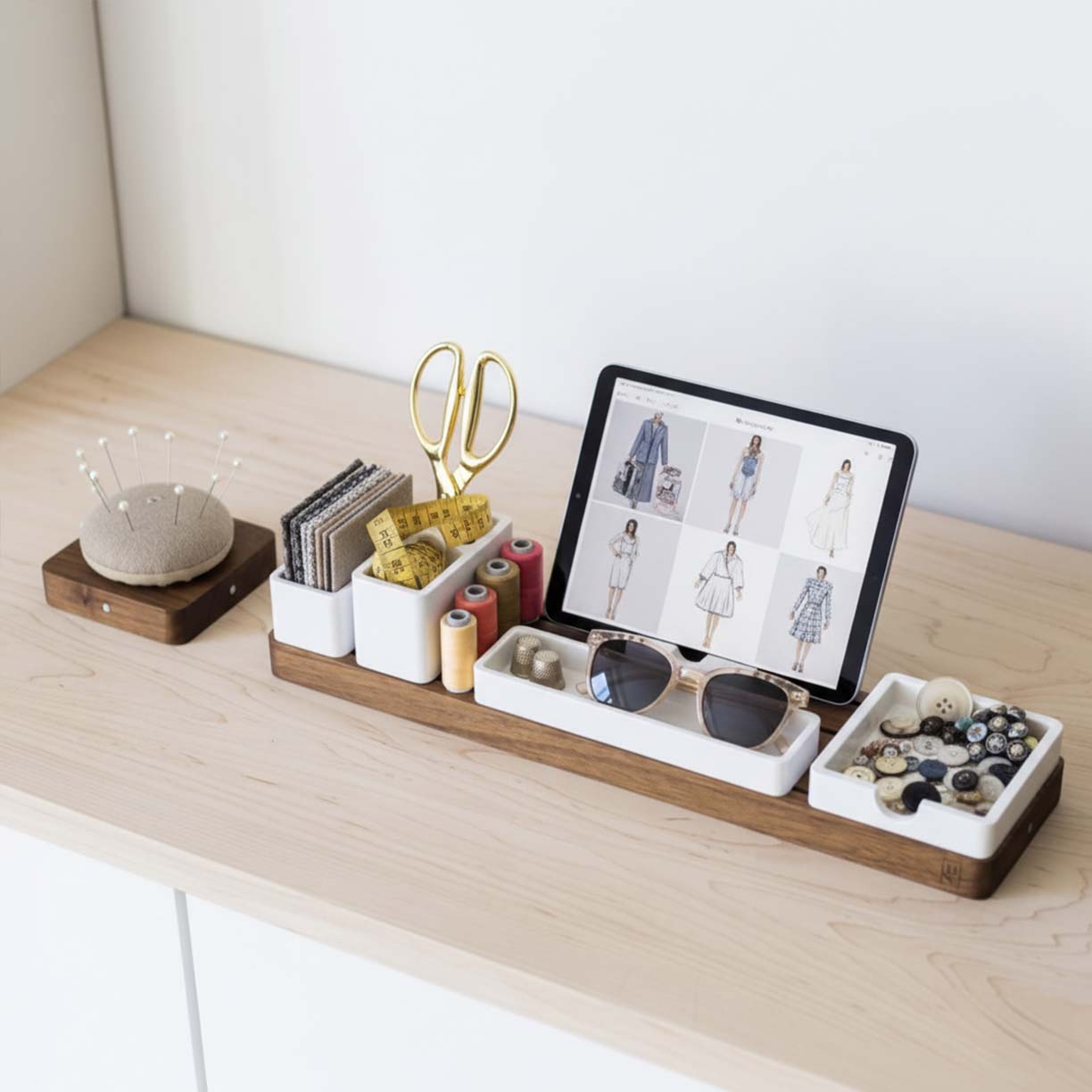 Walnut desk organizer set with white modular trays, next to porcelain mug on wooden desk.